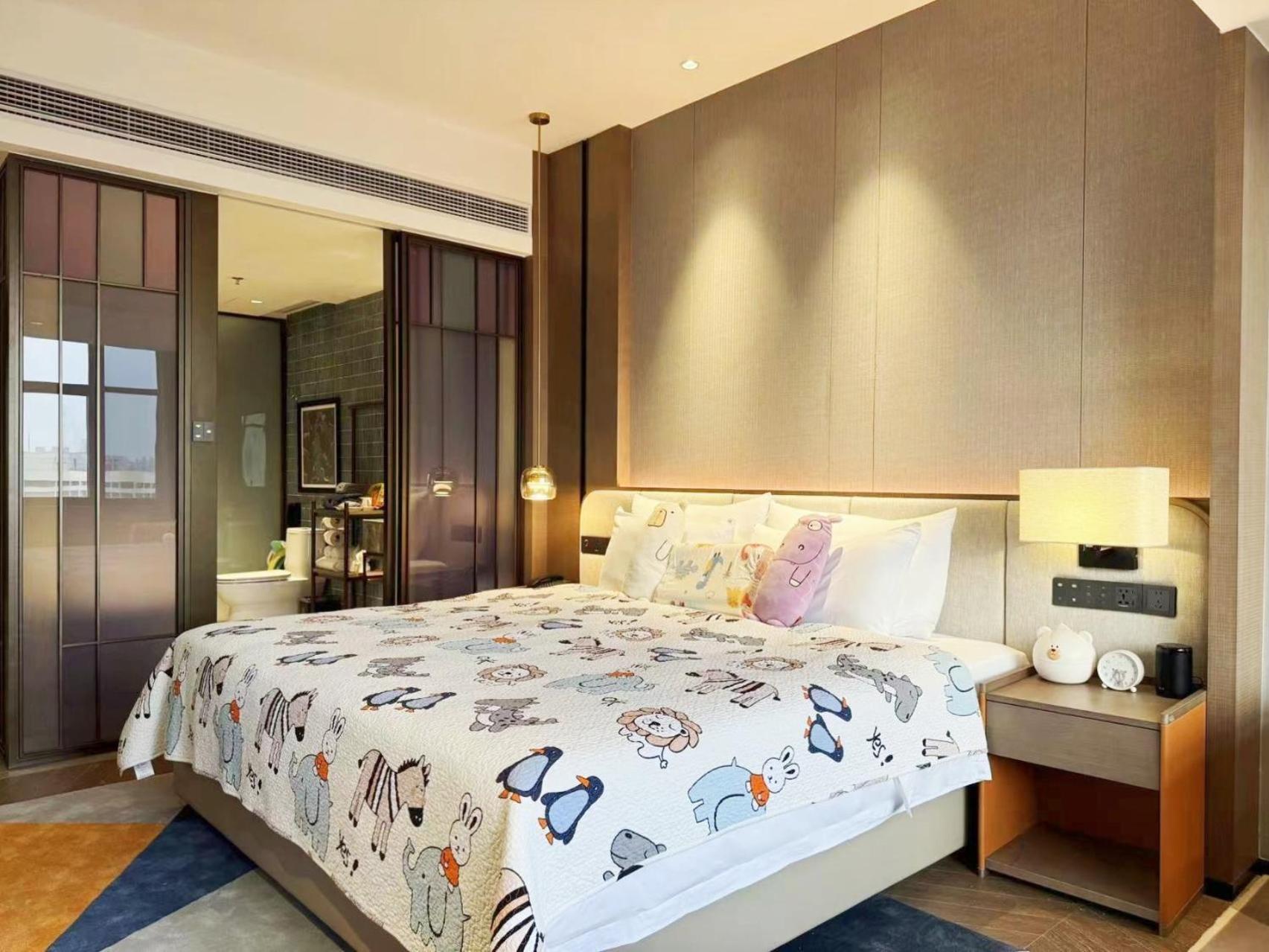 Guangzhou Baiyun Hotel Exteriér fotografie A bedroom at the hotel